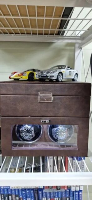 Brown double watch winder with two automatic watches