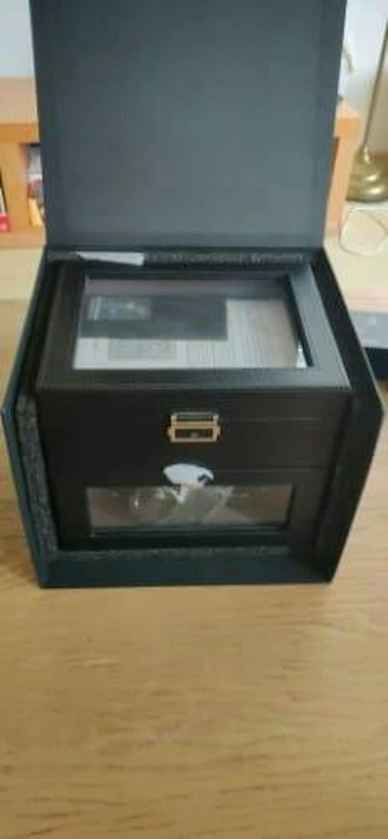 Glass top watch box displaying automatic watches