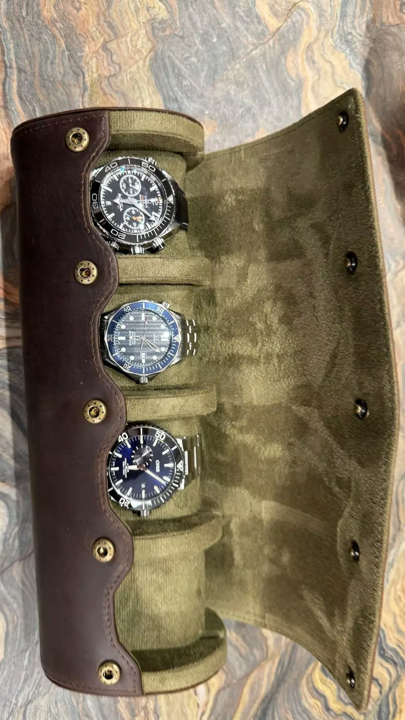 Watch winder with cream interior holding dive watches