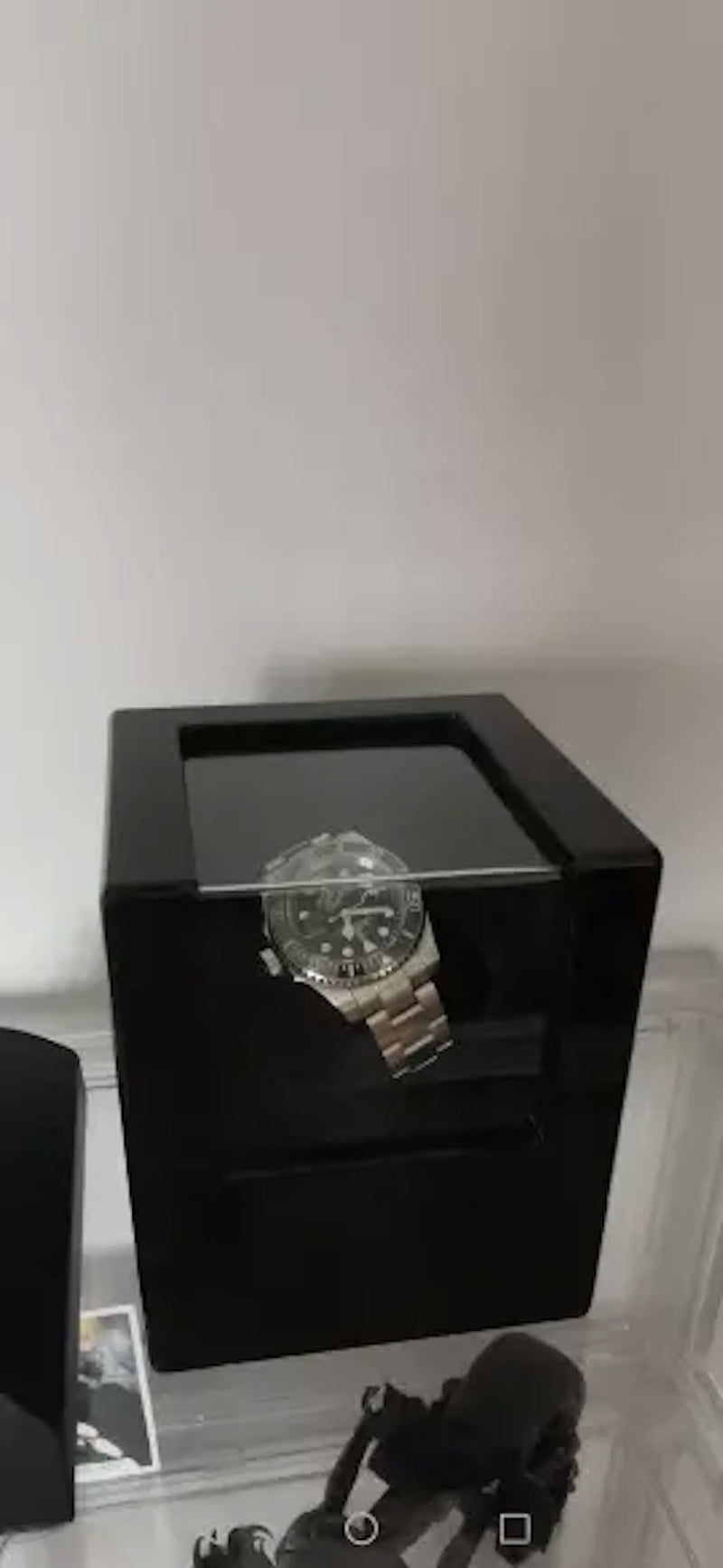 Automatic watch resting on a marble surface