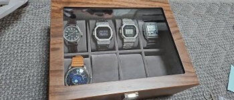 Watch box storing a collection of automatic watches